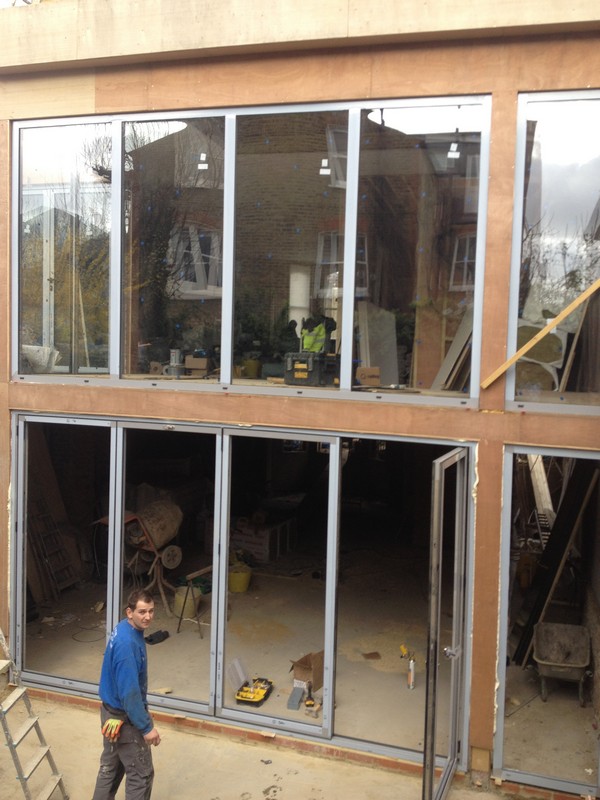 Aluminium bi-fold doors with two-storey glazing in Kentish Town