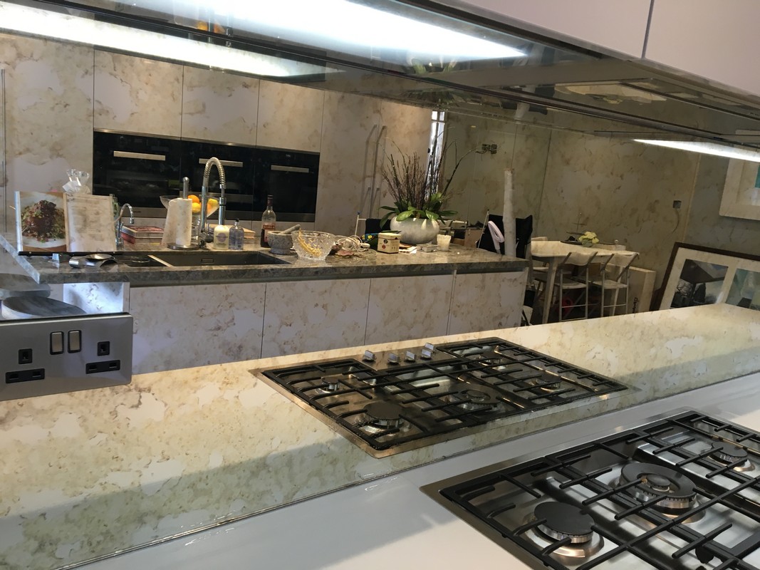 Mirror glass splashback in Kentish Town luxury kitchen